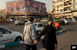 A banner showing slain Iranian, Hezbollah, and Hamas officials in Enqelab-e-Eslami (Islamic Revolution) Square in Tehran, Iran.